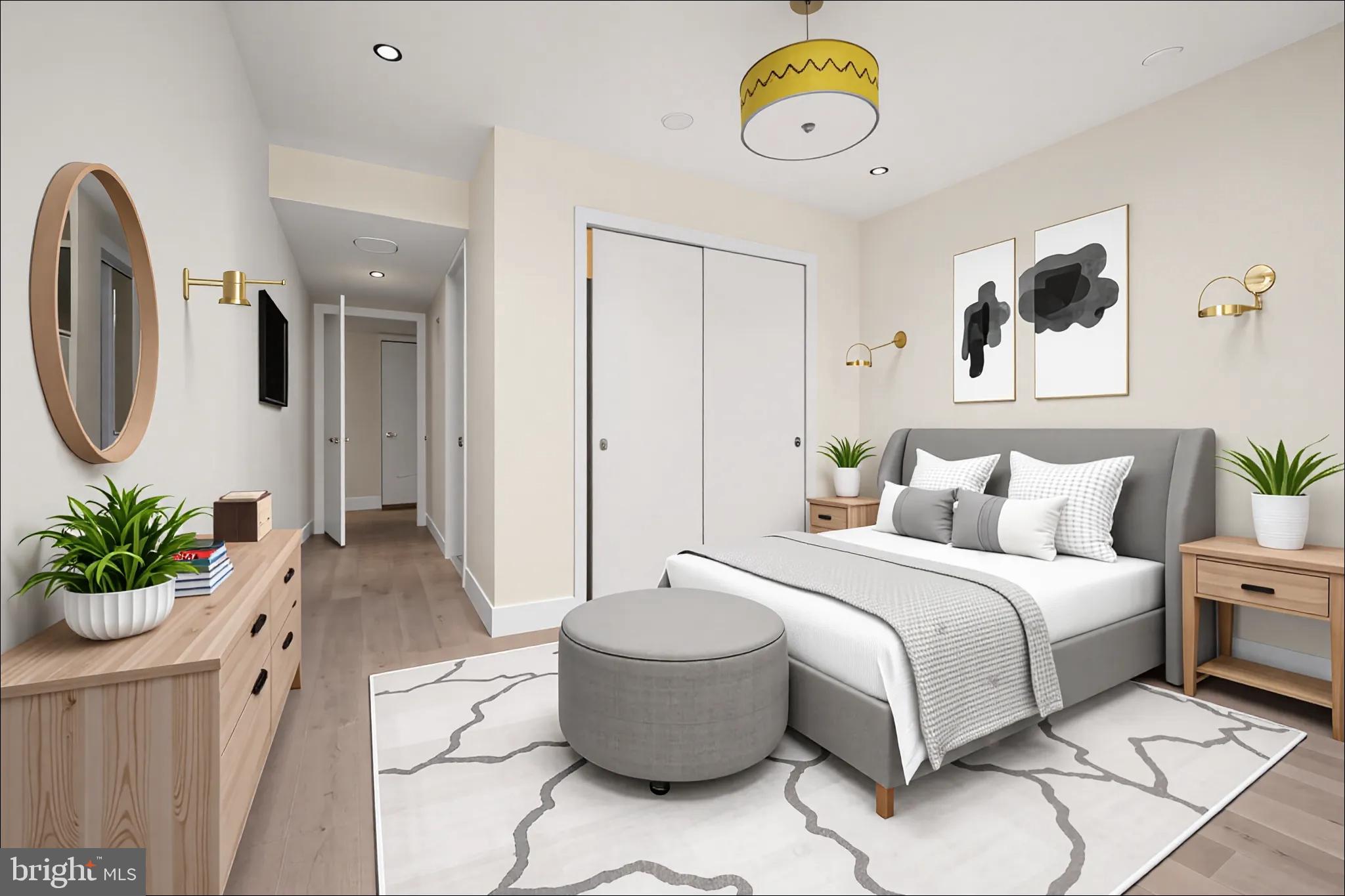 1055 Wisconsin Avenue Northwest, Unit 4E Washington, DC 20007 - Photo 36 of 58 a bedroom with a bed and a chandelier