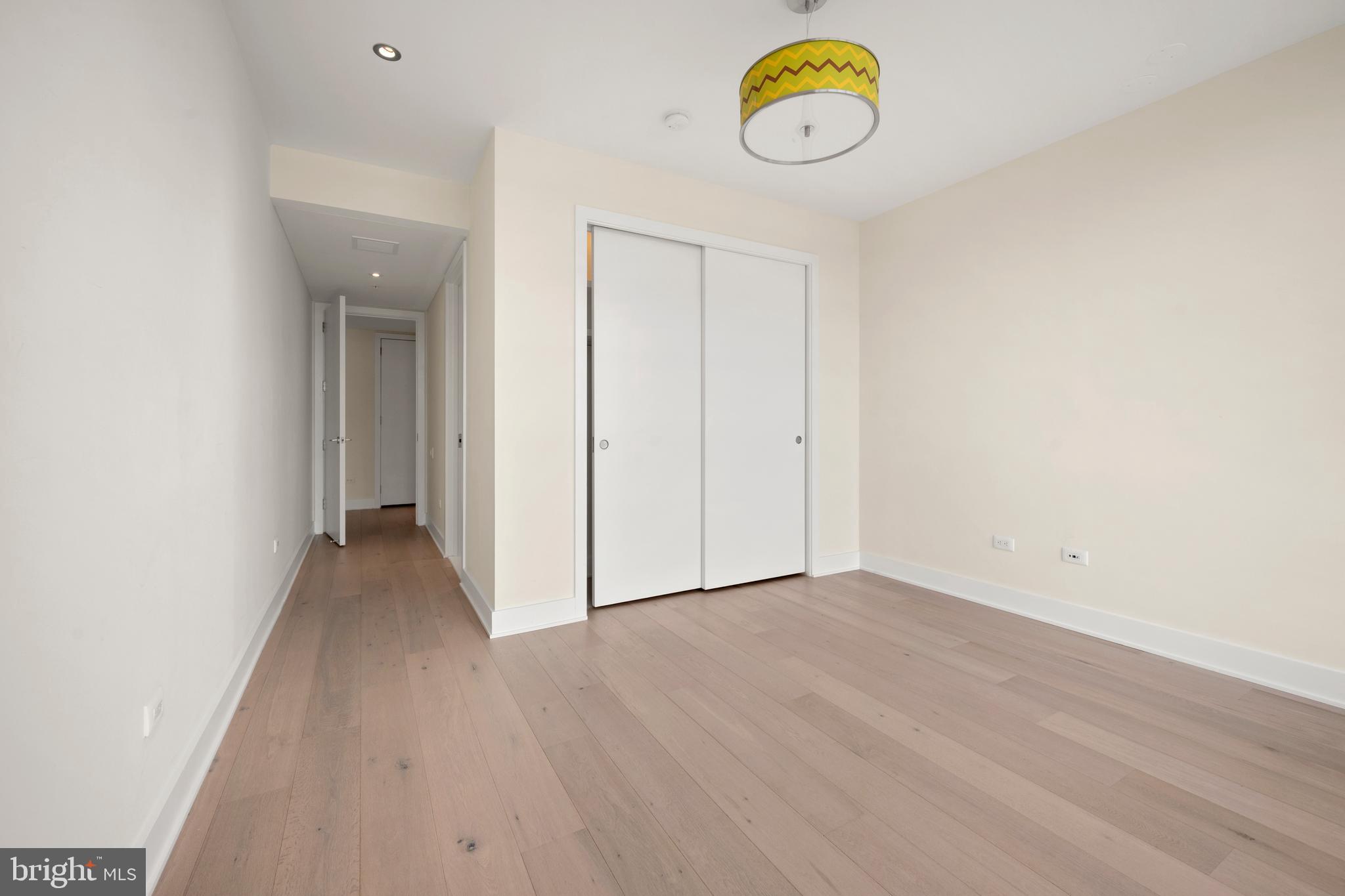 1055 Wisconsin Avenue Northwest, Unit 4E Washington, DC 20007 - Photo 37 of 58 a view of a room with wooden floor