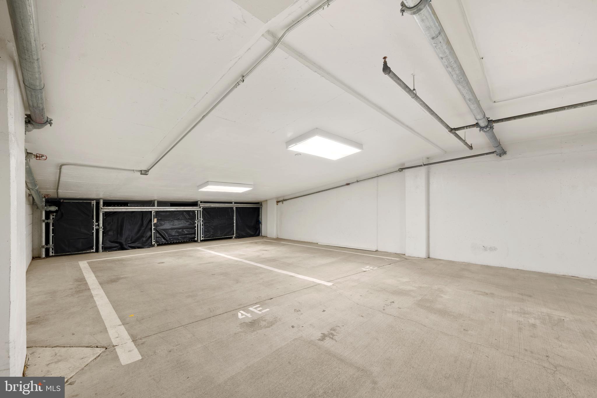 1055 Wisconsin Avenue Northwest, Unit 4E Washington, DC 20007 - Photo 46 of 58 a view of an empty room with windows