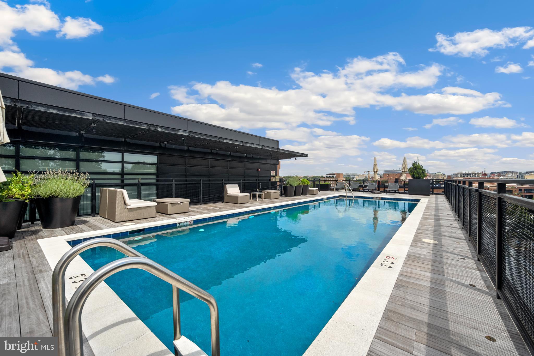 1055 Wisconsin Avenue Northwest, Unit 4E Washington, DC 20007 - Photo 48 of 58 a view of swimming pool with seating space