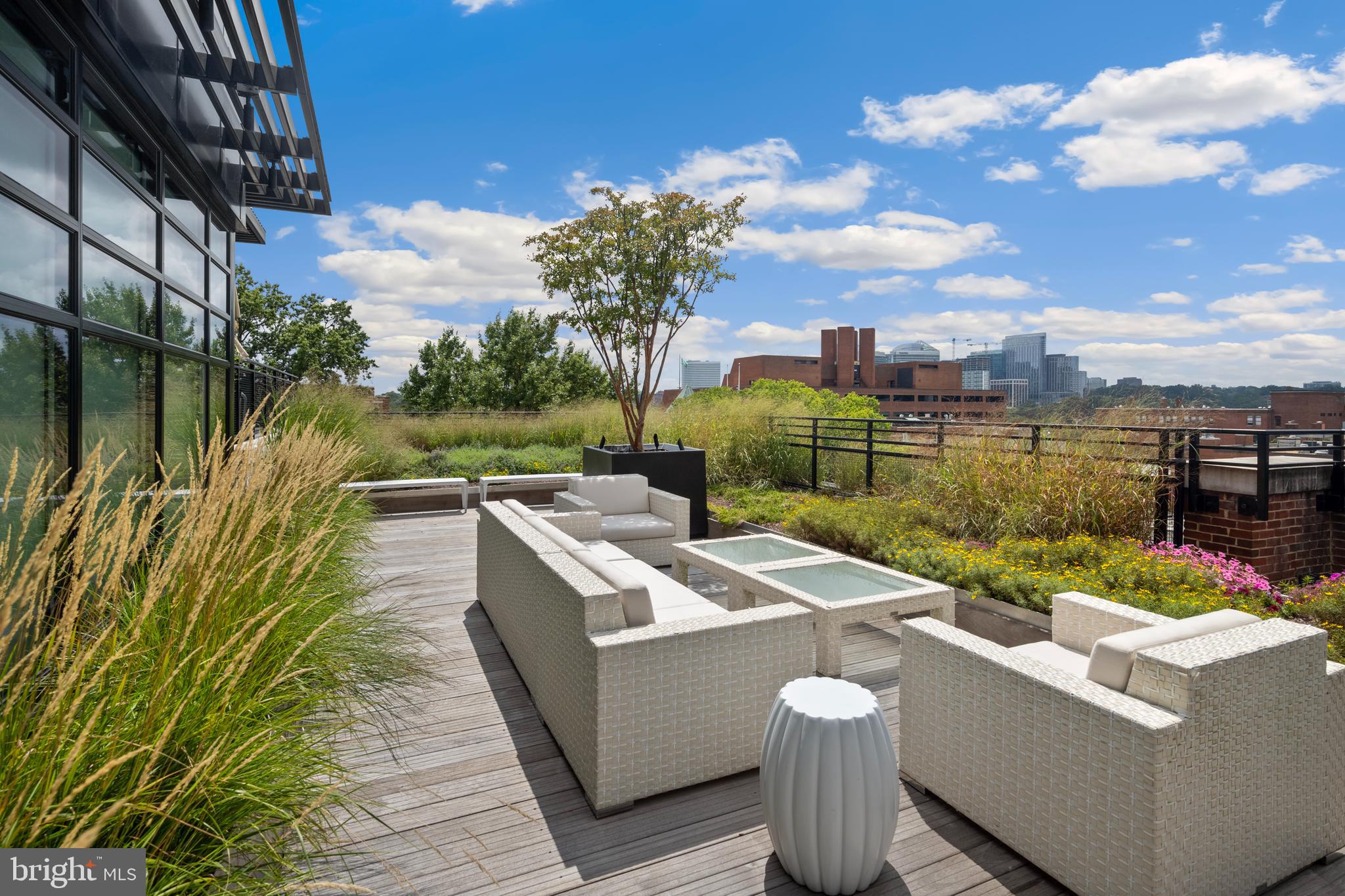 1055 Wisconsin Avenue Northwest, Unit 4E Washington, DC 20007 - Photo 50 of 58 a view of a patio with couches table and chairs