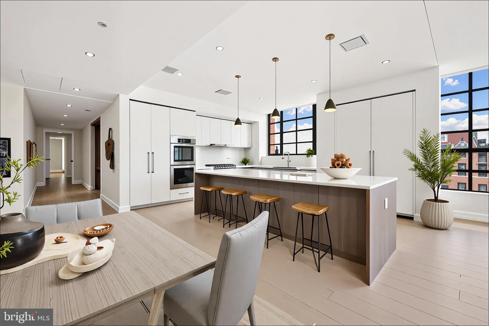 1055 Wisconsin Avenue Northwest, Unit 4E Washington, DC 20007 - Photo 5 of 58 a living room with stainless steel appliances kitchen island granite countertop furniture and a wooden floor