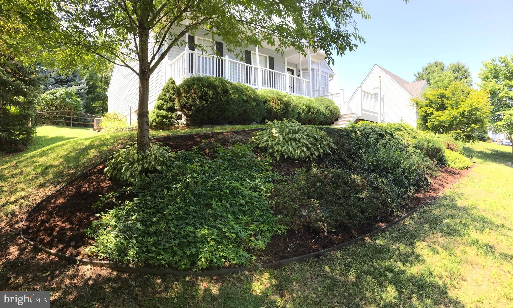 3221 Atlee Ridge Road New Windsor, MD 21776 - Photo 3 of 3 a view of a garden with plants and large trees