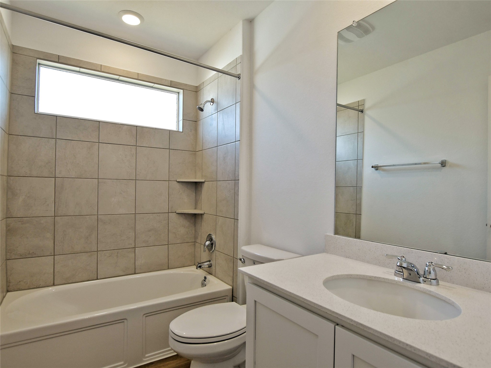 229 Vortex Pass Kyle, TX 78640 - Photo 22 of 32 a bathroom with a sink a toilet and shower