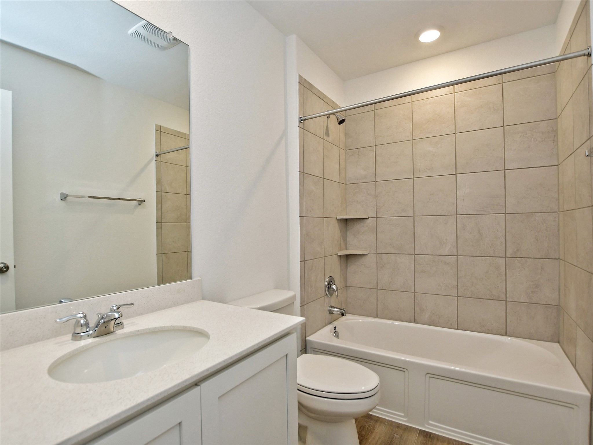 229 Vortex Pass Kyle, TX 78640 - Photo 24 of 32 a bathroom with a sink mirror toilet and bathtub