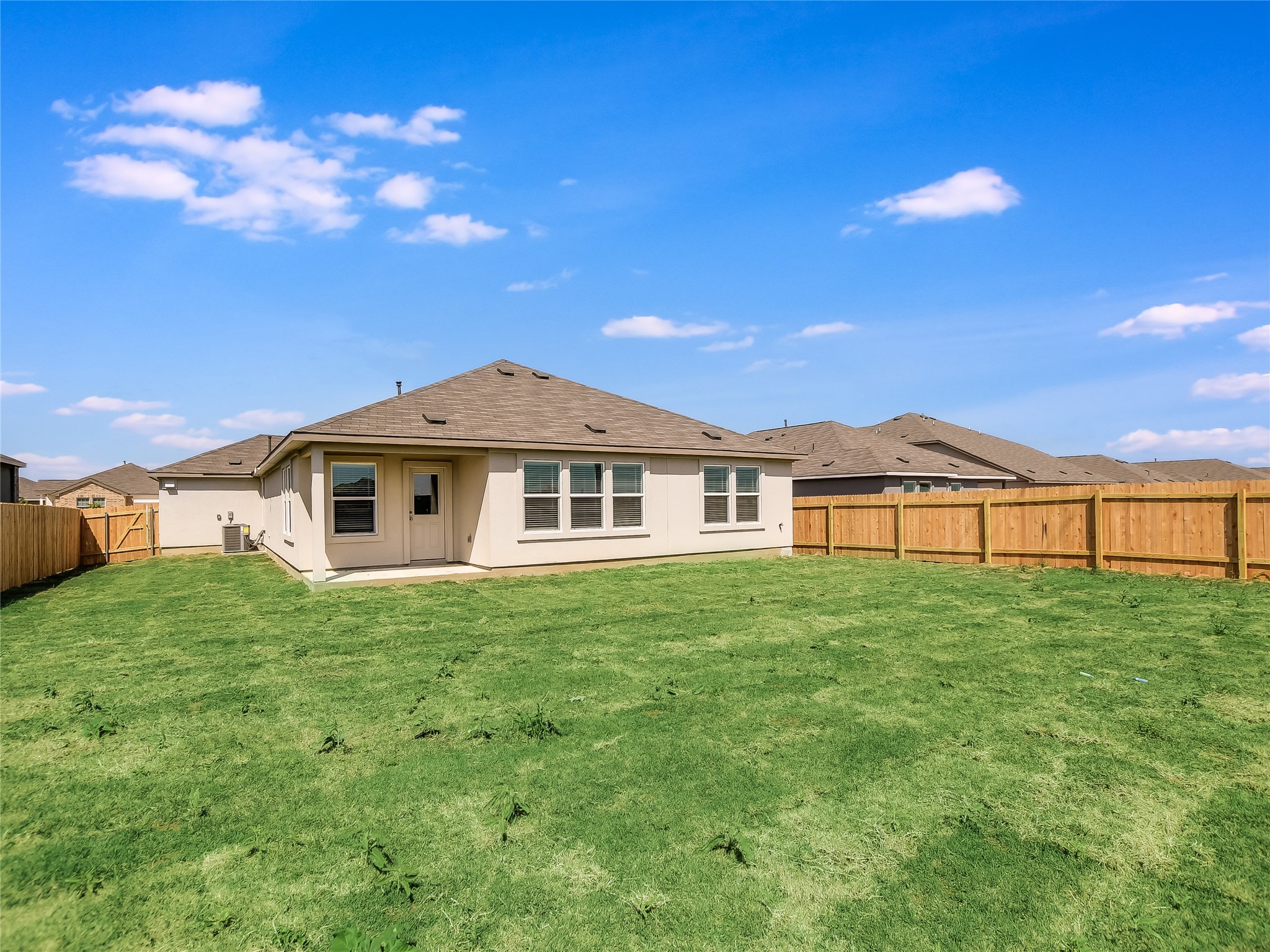 229 Vortex Pass Kyle, TX 78640 - Photo 27 of 32 a front view of a house with a yard