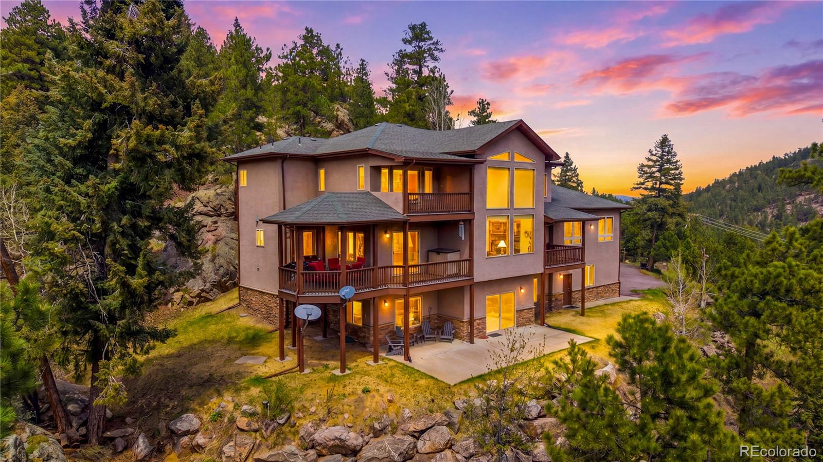 9659 South Turkey Creek Road Morrison, CO 80465 - Photo 1 of 49 a front view of a house with a yard
