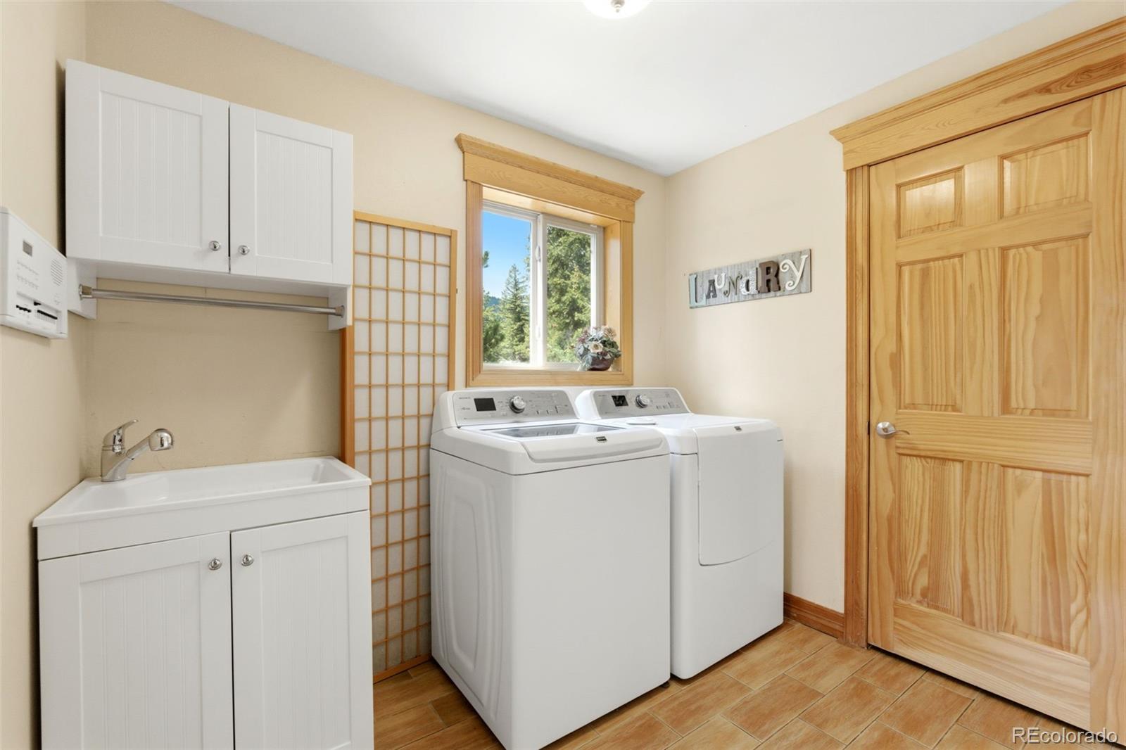 9659 South Turkey Creek Road Morrison, CO 80465 - Photo 12 of 49 a utility room with dryer and washer