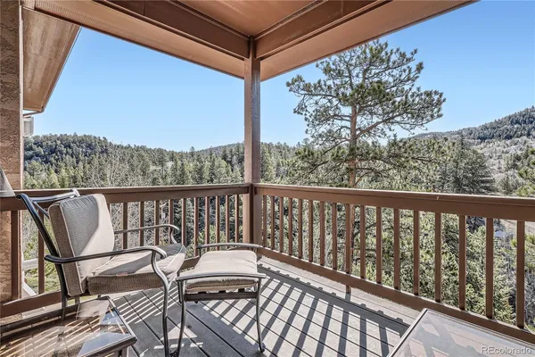 a view of balcony with furniture