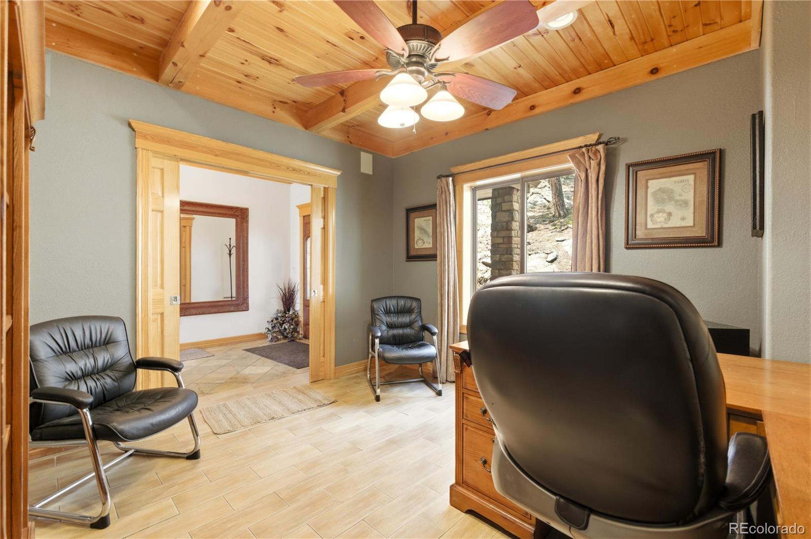 9659 South Turkey Creek Road Morrison, CO 80465 - Photo 15 of 49 a living room with furniture and a window