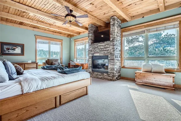 a view of a livingroom with furniture and a fireplace