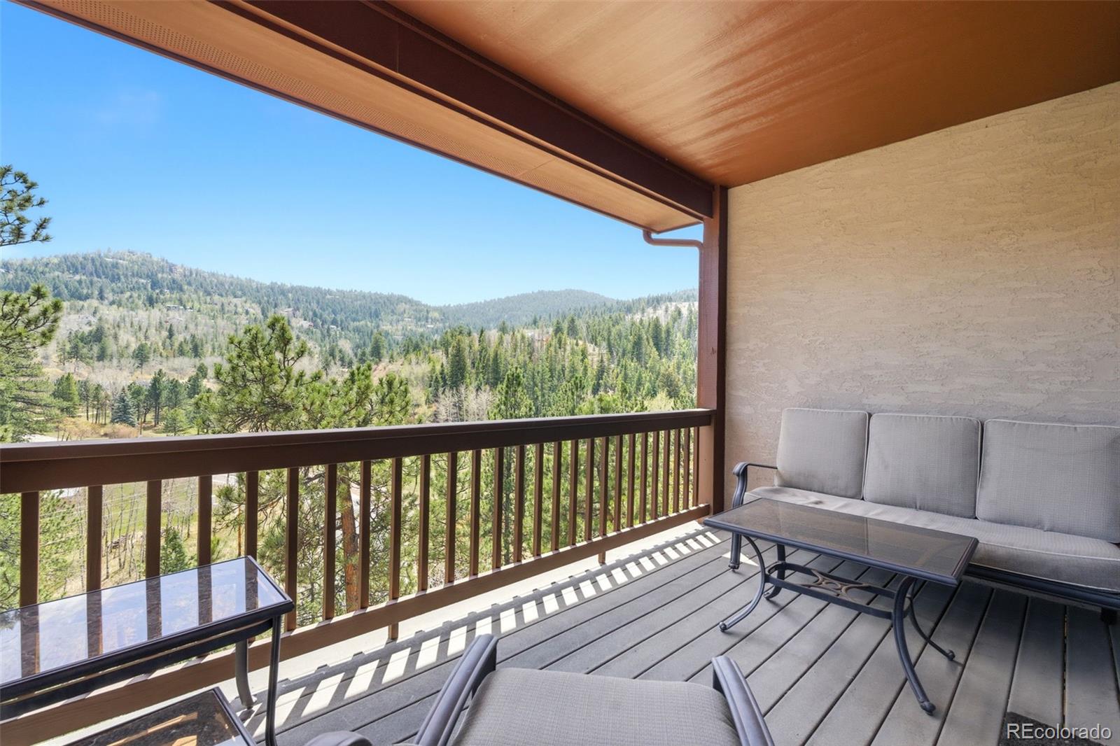 9659 South Turkey Creek Road Morrison, CO 80465 - Photo 18 of 49 a view of a two chairs in the balcony