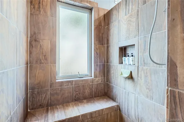 a bathroom with a glass shower door