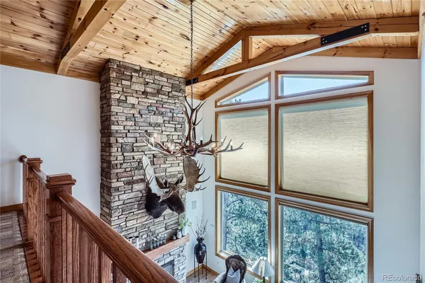 a bathroom with a glass door shower and a sink