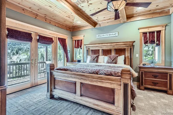 a bed sitting in a room next to a window