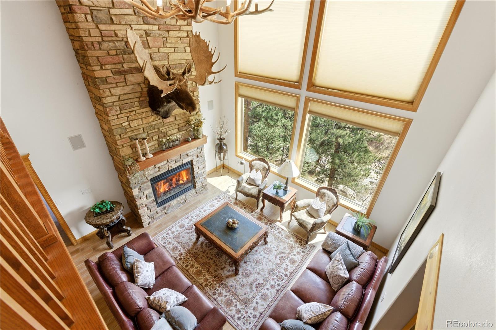 9659 South Turkey Creek Road Morrison, CO 80465 - Photo 26 of 49 a living room with furniture and a floor to ceiling window