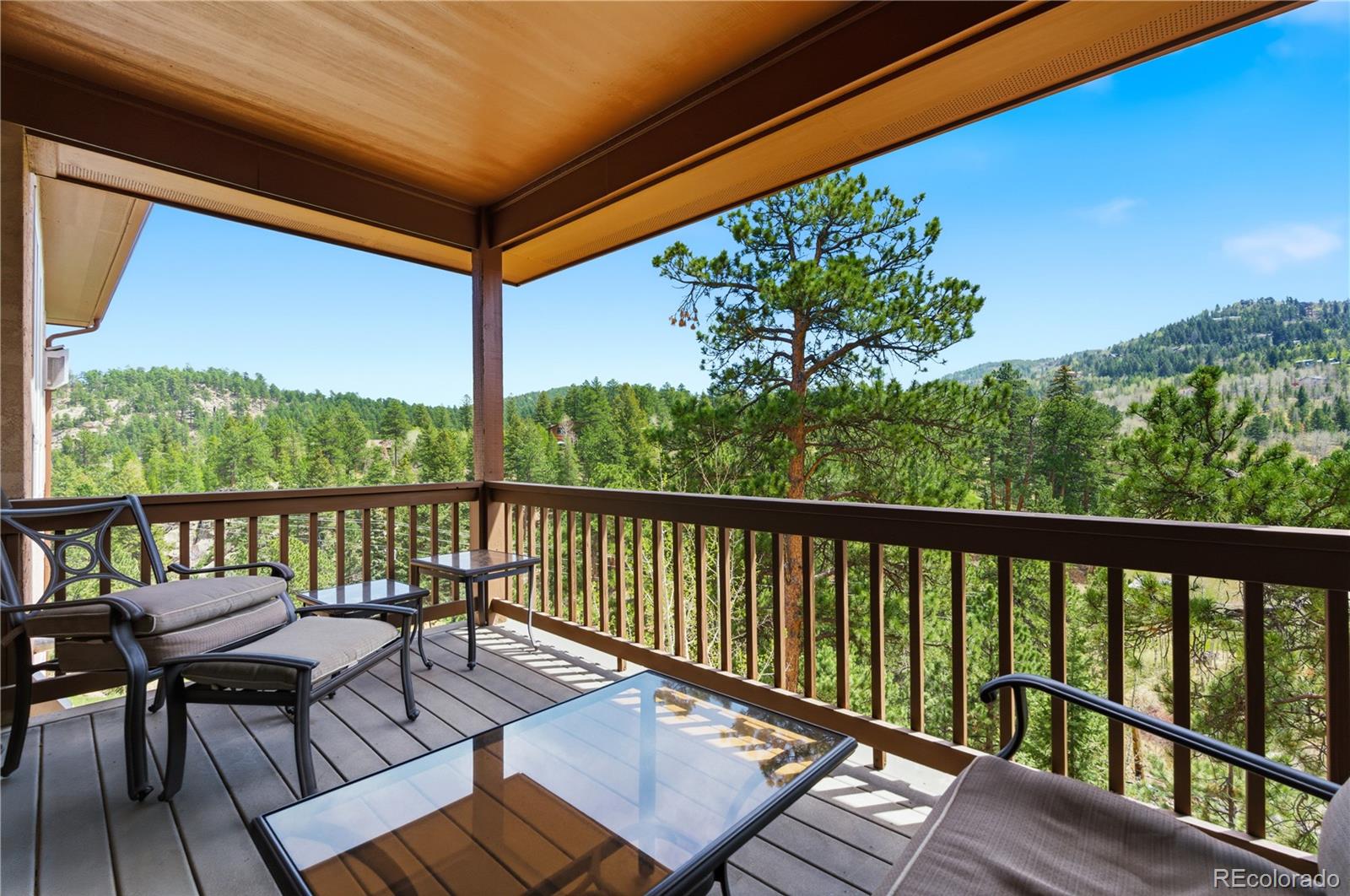 9659 South Turkey Creek Road Morrison, CO 80465 - Photo 31 of 49 a view of a two chairs in the balcony