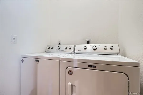 a room with gym equipment and a flat screen tv