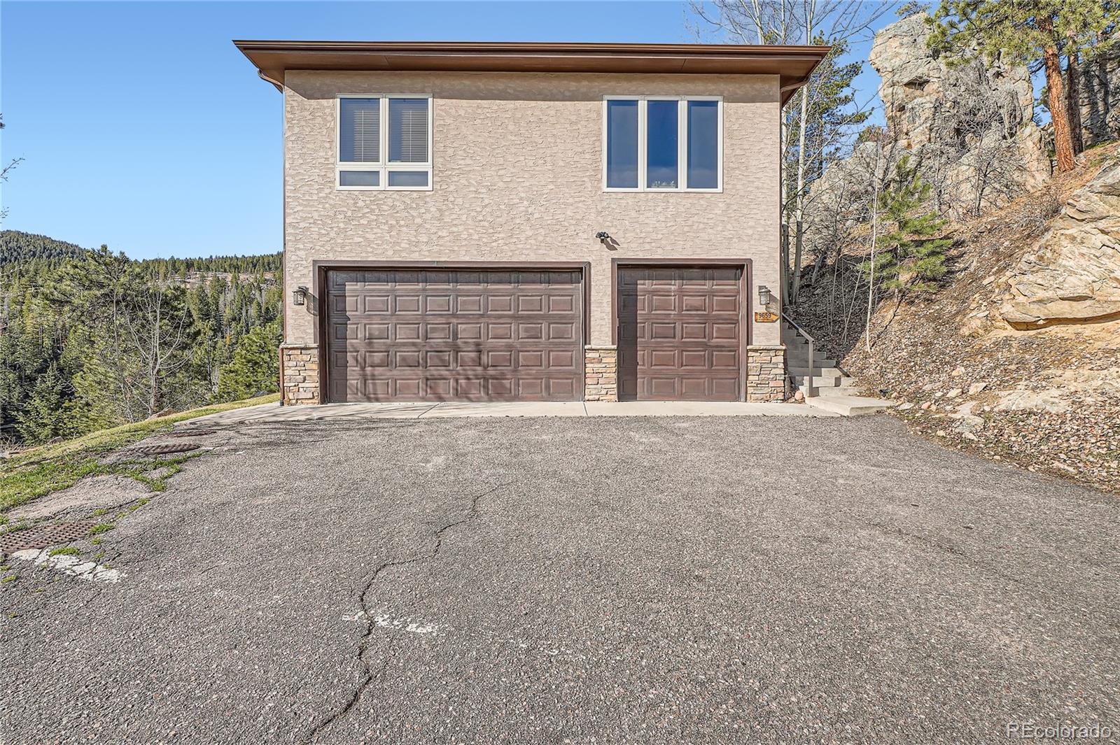 9659 South Turkey Creek Road Morrison, CO 80465 - Photo 37 of 48 a view of an house with a outdoor space
