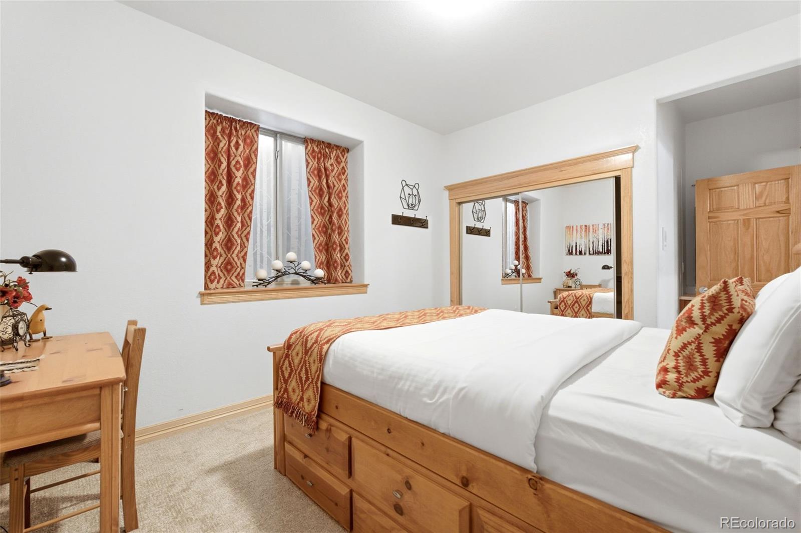 9659 South Turkey Creek Road Morrison, CO 80465 - Photo 40 of 49 a bedroom with a bed and window