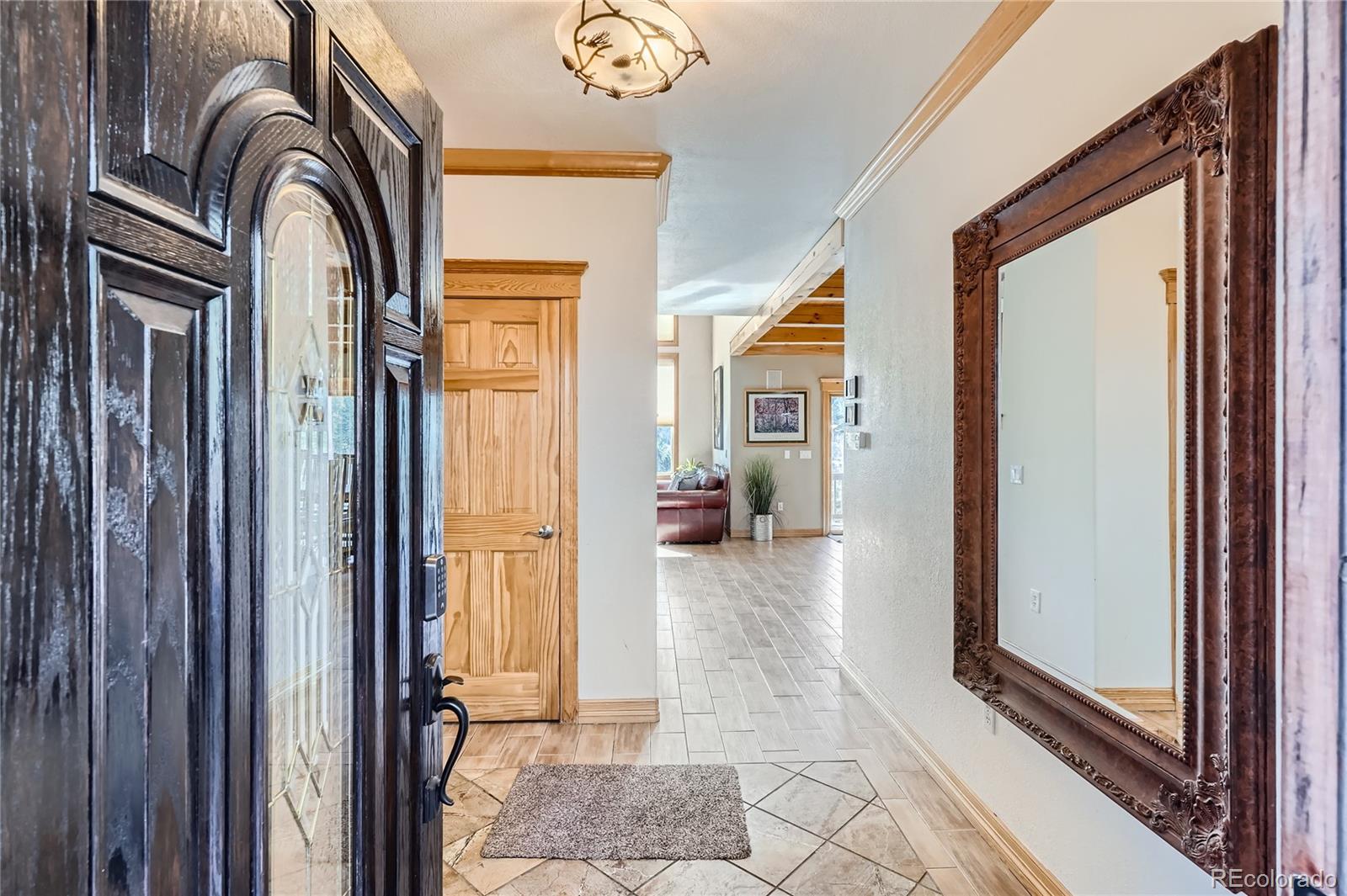 9659 South Turkey Creek Road Morrison, CO 80465 - Photo 6 of 48 a view of living room and front door