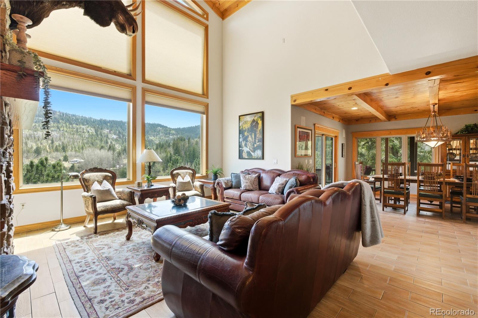 9659 South Turkey Creek Road Morrison, CO 80465 - Photo 6 of 49 a living room with furniture and a large window