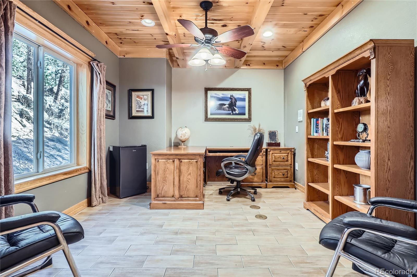 9659 South Turkey Creek Road Morrison, CO 80465 - Photo 7 of 48 a view of workspace with lounge chair windows musical instrument