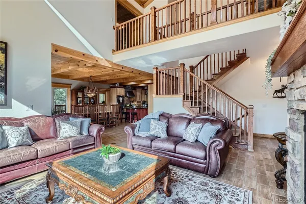 a living room with furniture and a table