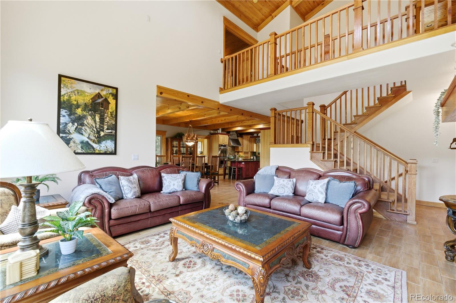 9659 South Turkey Creek Road Morrison, CO 80465 - Photo 8 of 49 a outdoor living room with furniture a rug and a window