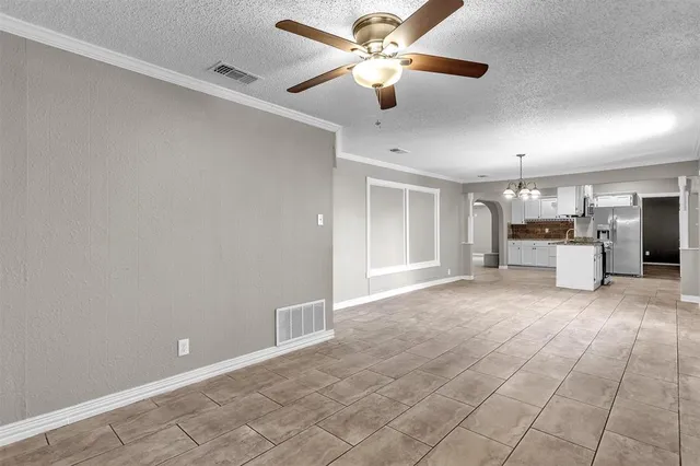 a view of a livingroom with a kitchen