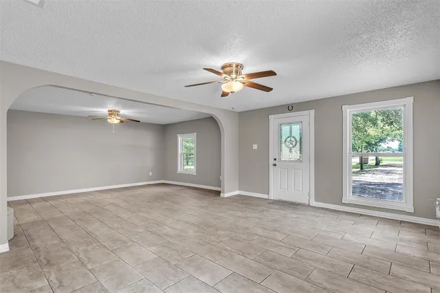 a view of an empty room and window