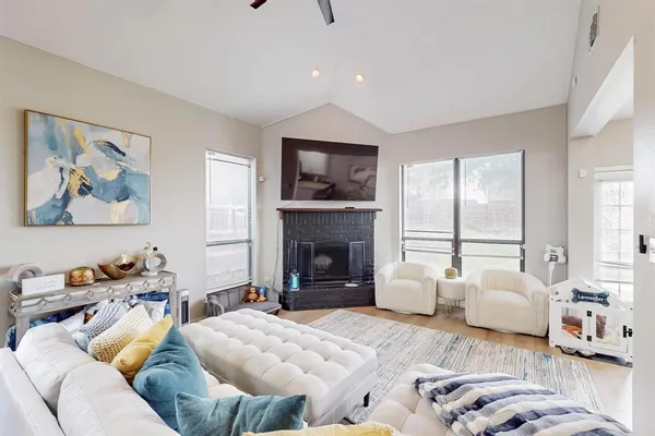 a living room with furniture and a fireplace