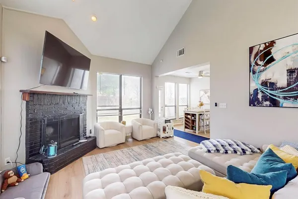 a bedroom with furniture and a fireplace