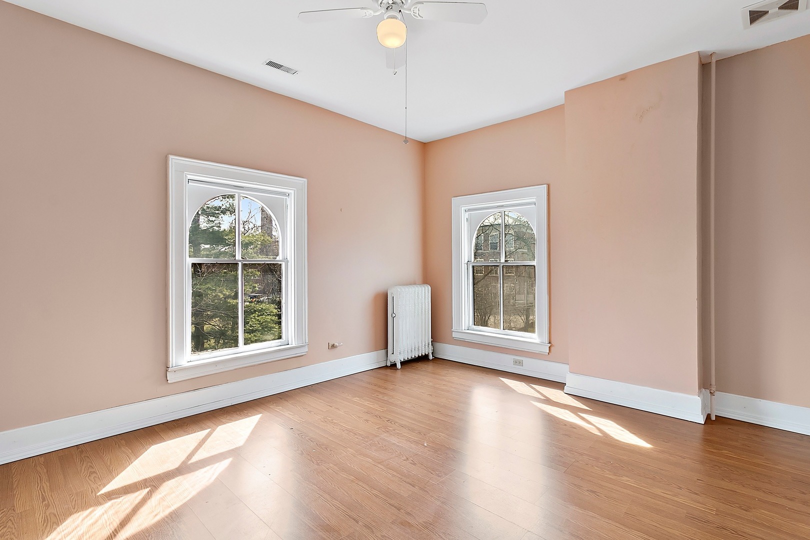 110 Akenside Road Riverside, IL 60546 - Photo 12 of 29 a view of an empty room with wooden floor and a window