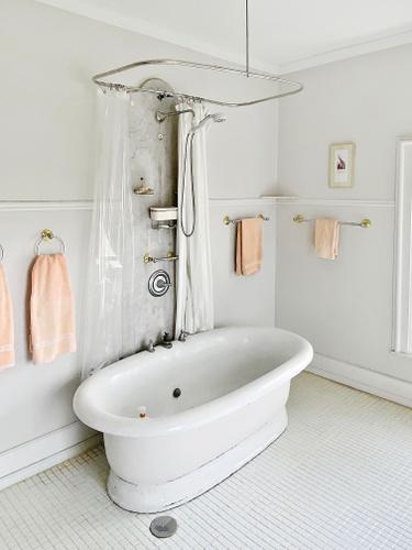 110 Akenside Road Riverside, IL 60546 - Photo 13 of 29 a bathroom with a tub a window and a shower