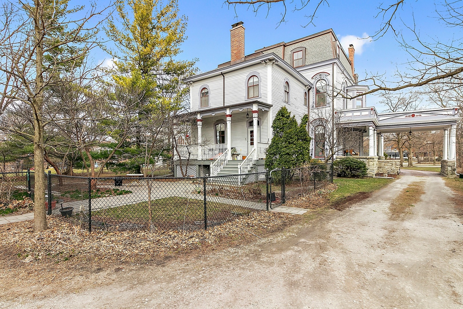 110 Akenside Road Riverside, IL 60546 - Photo 18 of 29 a view of a white house next to a yard with large trees