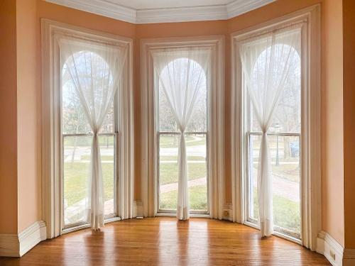 110 Akenside Road Riverside, IL 60546 - Photo 4 of 29 a view of empty room with wooden floor and windows