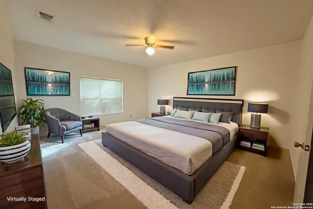 a bedroom with bed and a chandelier