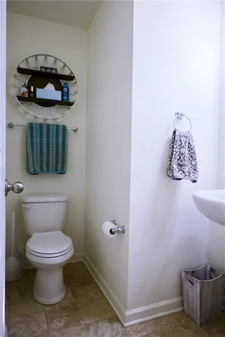 a bathroom with a toilet and a sink