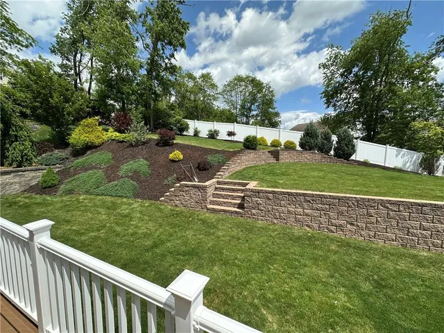 a garden view with a seating space