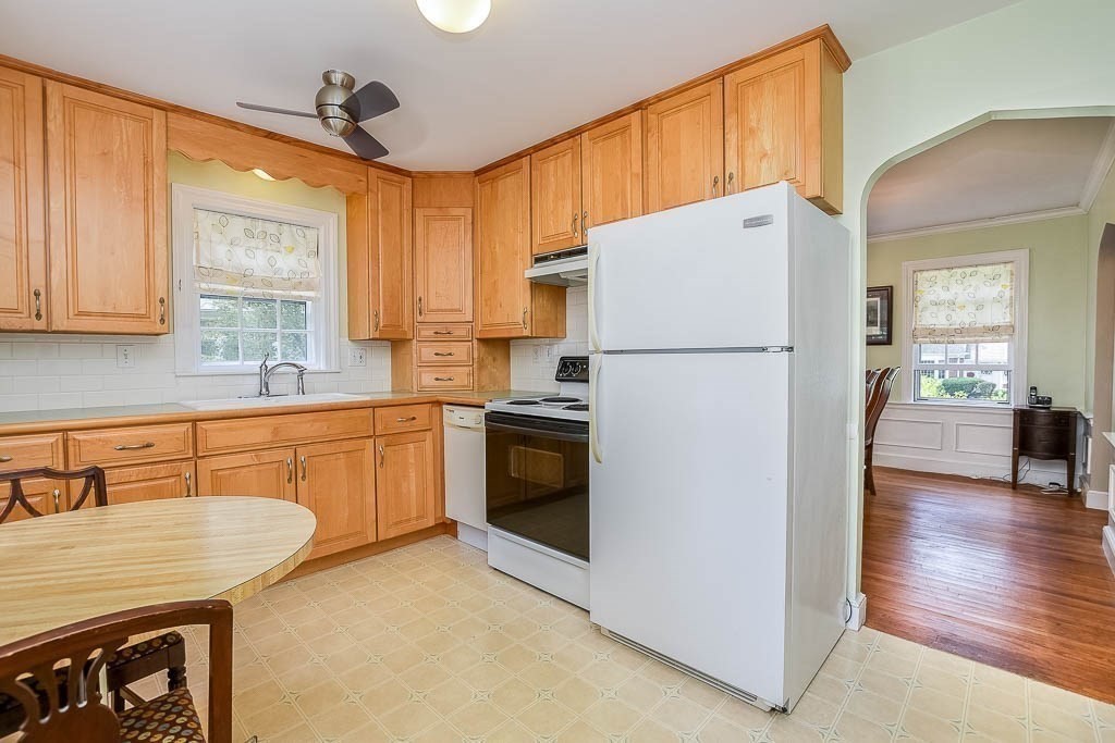 46 Park Street Dedham, MA 02026 - Photo 16 of 35 a white refrigerator freezer sitting inside of a kitchen