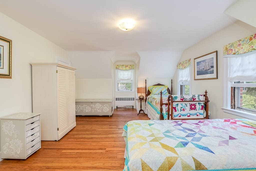46 Park Street Dedham, MA 02026 - Photo 22 of 35 a bedroom with furniture and a wooden floor