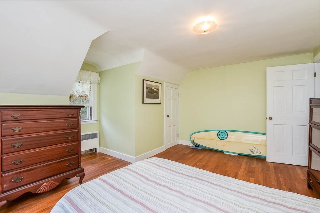 46 Park Street Dedham, MA 02026 - Photo 27 of 35 a bedroom with a bed and a dresser