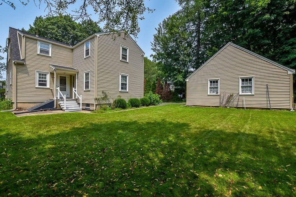 46 Park Street Dedham, MA 02026 - Photo 28 of 35 a view of a house with a yard and sitting area