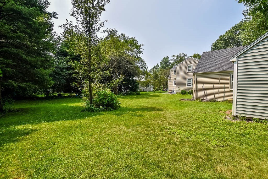 46 Park Street Dedham, MA 02026 - Photo 32 of 35 a view of a backyard with a garden