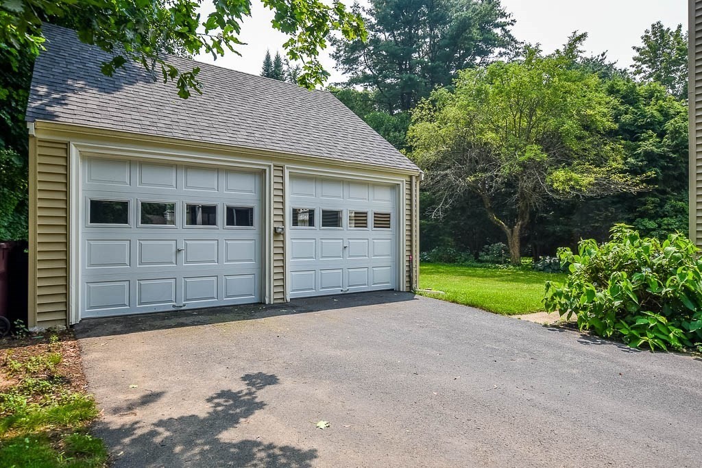 46 Park Street Dedham, MA 02026 - Photo 33 of 35 a view of a house with a yard and potted plants
