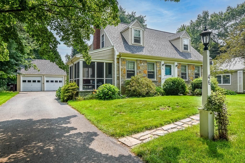 46 Park Street Dedham, MA 02026 - Photo 5 of 35 a front view of a house with a garden