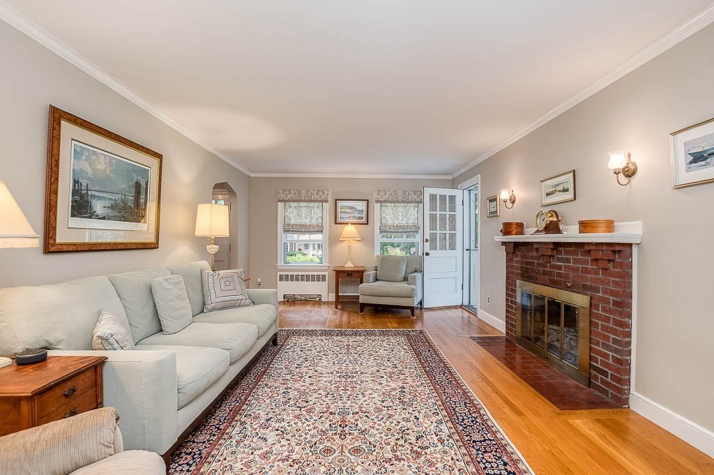 46 Park Street Dedham, MA 02026 - Photo 8 of 35 a living room with furniture and a fireplace