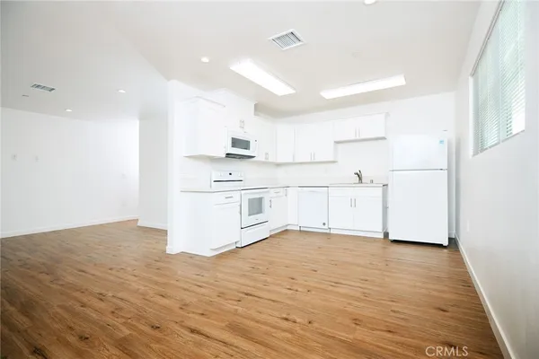 a view of kitchen with wooden floor