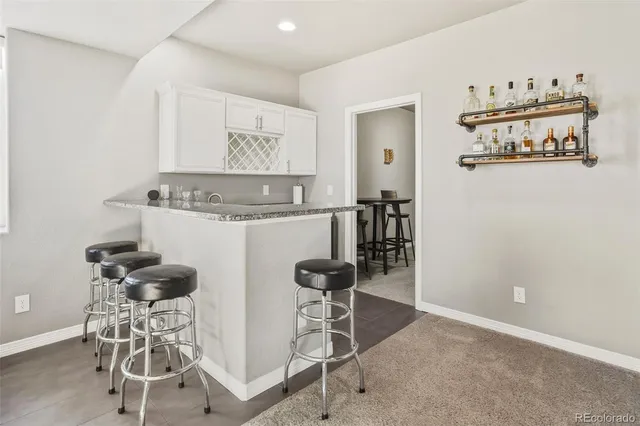 a view of a workspace with furniture